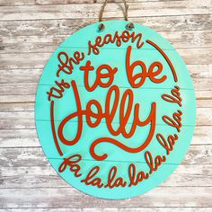 there is a sign that says be reason to be jolly on the wood planks