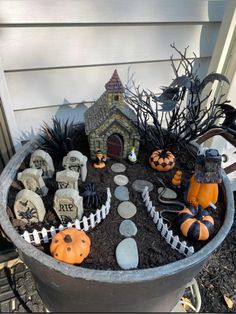 a potted planter filled with halloween decorations