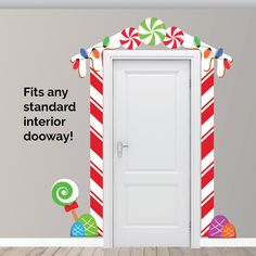 an open door with candy canes and candies on the wall next to it