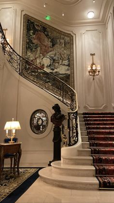 an ornate staircase in the middle of a room