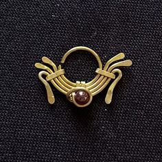 a gold ring with a stone in the middle