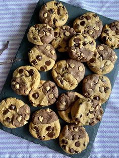 chocolate chip cookies arranged on a slate board