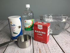 ingredients to make an ice cream cake sitting on a table next to a measuring cup