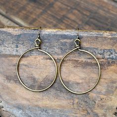 These are antiqued Gold wire wrapped hoop earrings on antiqued Gold ear wire. They hang approximately 2 1/2 inches. Vintage Wire Wrapped Brass Earrings, Vintage Brass Wire Wrapped Earrings, Bronze Brass Wire Wrapped Hoop Earrings, Bronze Wire Wrapped Hoop Earrings, Brass Hoop Earrings With Oxidized Finish, Oxidized Brass Hoop Earrings, Wire Wrapped Brass Hoop Earrings, Vintage Brass Hoop Earrings With Ear Wire, Wire Wrapped Brass Dangle Hoop Earrings