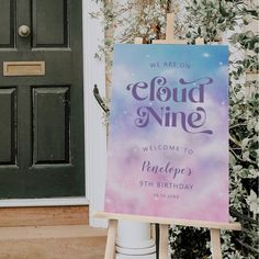 a welcome sign in front of a door for a birthday party with the words cloud nine on it