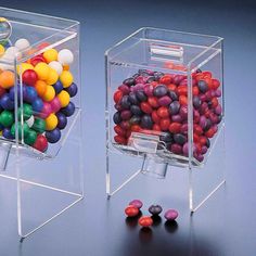 two clear boxes filled with different colored candies