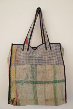 a multicolored bag hanging on the wall