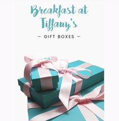 two blue boxes with pink bows and the words breakfast at tiffany's gift boxes