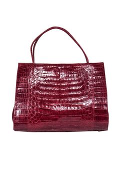 Classic style meets bohemian beauty in the bag from Nancy Gonzalez! The classic structured handbag is given a safari chic makeover with 100% croc leather in a ravishing red hue. Perfect for fashionistas who love their animal print! Pair with a sleek sheath dress and pumps for a fiercely fab look that'll have you ready for cocktail parties, networking events and beyond! Crocodile leather Top magnetic closure Top carrying handles Structured design Suede lining One interior zippered compartment One Red Leather Satchel With Crocodile Pattern, Elegant Red Crocodile Pattern Satchel, Luxury Red Bags With Crocodile Pattern, Elegant Red Satchel With Crocodile Pattern, Red Top Handle Bag With Crocodile Pattern, Chic Red Crocodile Pattern Bag, Formal Red Crocodile Pattern Shoulder Bag, Red Crocodile Pattern Shoulder Bag For Shopping, Red Crocodile Pattern Rectangular Bag