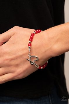 A shiny silver heart frame interlocks with a toggle closure at the center of a shiny silver and glassy red beaded bracelet. The silver toggle is stamped in the word, "love," for a romantic finish. Features a toggle closure.

 Sold as one individual bracelet. Red Beaded Bracelet, The Word Love, Word Love, Party Necklace, Red Bracelets, Red Jewelry, Heart Frame, Toggle Bracelet, Paparazzi Accessories