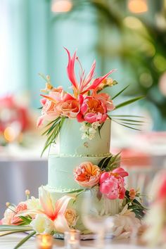 a wedding cake decorated with flowers and greenery