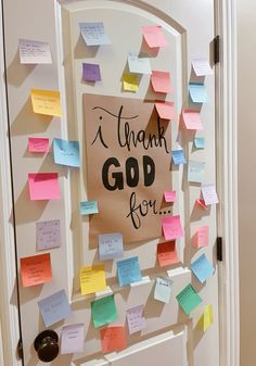 a door decorated with post it notes that say thank god for