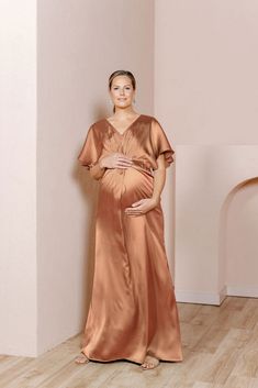 Our graceful Gwen Satin dress has been modified with a higher waistline and extra room to accommodate a growing bump, becoming the perfect option for the mommy-to-be in your bridal party! While a little more modest in coverage, the Gwen still features flutter sleeves and a delicate front twist detail that adds sophistication to a timeless design. FEATURES: Empire silhouette V-neckline Built-in bra cups and vertical boning for support Dolman flutter sleeves Back zipper Full-length double lining f Wedding Parties Colors, Empire Silhouette, Bridesmaid Dress Colors, Family Fashion, Family Maternity, Extra Room, Dress Elegant, Satin Dress, Fashion Photoshoot