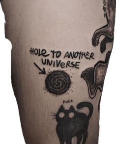 a man's leg with tattoos on it that says hole to another universe and an image of a cat