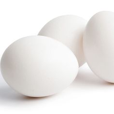 three white eggs sitting next to each other