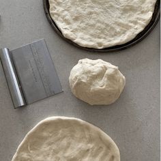 the dough is ready to be made into pizza crusts with a rolling pin nearby