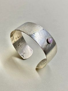 { d e s c r i p t i o n } RARE/Modernist sterling silver ring bracelet with Amethyst handmade by Heikki Kaksonen in 1959, Made in Finland Designer: Heikki Kaksonen Manufacturer: Kaunis koru Design year: 1959 Material: Sterling Silver, Amethyst  Marks: HK( Heikki Kaksonen), 813H( Silver ),  Boat ( Helsinki ), F7 ( Made in 1959),  Size :  Inside Diameter: About 6 cm (About 2.36inches)  Size adjustable  Good vintage condition, slight sign of use, ready to wear. Please check the pictures. { shipping Green Stone Rings, Minimalist Gifts, Sterling Silver Bracelet, Helsinki, Ring Bracelet, Sterling Silver Bracelets, Stone Rings, Silver Fashion, Silver Ring