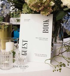 a table topped with vases and candles next to a sign that says just do it