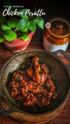 chicken peratta in a frying pan next to a jar of honey