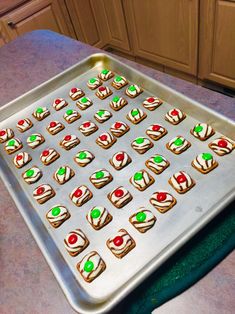 there are many cookies on the pan ready to be made into cupcakes for christmas