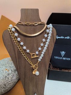 🌟 Indulge in luxury with our Layered Chain Charm Necklace. Crafted with imitation pearl beads and metal chains, this necklace is perfect for adding a touch of elegance to any outfit. With its multi-strand design, it's a must-have for any fashion-forward woman. Elevate your jewelry collection with this exquisite piece. * Iron/alloy/brass/imitation pearl * 13 3/4" (35cm)  length, 7cm extender * 5 1/2" (14cm)  length, 7cm extender * 15 3/4" (40cm)  length, 7cm extender * 17 3/4" (45cm)  length, 7c Pearl Chain Layered Necklace As A Gift, Pearl White Pearl Necklace With Chain, Pearl White Metal Chain Necklace, Party Layered Pearl Necklace With Pearl Chain, White Pearl Necklace With Pearl Chain, Metal Beaded Necklace With Pearl Chain, Metal Layered Necklace With Pearl Chain For Gift, Layered Metal Necklace With Pearl Chain For Gift, Pearl Chain Metal Layered Necklace For Gift