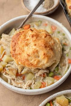 two white bowls filled with chicken pot pies