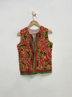 Indian Handmade Women's Embroidered Phulkari Jacket, Sleeveless Embroidered Jacket For Women, Bohemian Waistcoat For Her Product Detail Color:- As Shown In Picture Material:- Fulkari, Embroidered, Cotton Length:- 23inch / 60cm Bust:- 40inch / 102cm Arm Hole:- 10inch / 52cm NOTE : Product color may slightly vary due to photographic lighting sources or your monitor settings. Sleeveless Multicolor Choli With Floral Embroidery, Sleeveless Multicolor Floral Embroidered Choli, Sleeveless Multicolor Floral Embroidery Choli, Bohemian Sleeveless Outerwear For Spring, Spring Bohemian Fitted Nehru Jacket, Bohemian Sleeveless Summer Outerwear, Sleeveless Bohemian Summer Outerwear, Festival Multicolor Sleeveless Choli, Fitted Sleeveless Outerwear For Festival