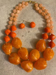 Orange jewelry with matching earrings set. Costume jewelry Orange Round Beads Party Jewelry, Orange Round Beads Jewelry For Party, Orange Faceted Beads Jewelry, Orange Large Beaded Jewelry For Party, Orange Faceted Beads For Jewelry Making, Orange Round Faceted Beads Jewelry, Orange Faceted Beads For Crafting, Orange Faceted Beads Jewelry For Gift, Orange Adjustable Costume Jewelry