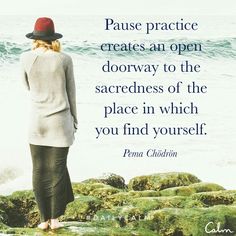 a woman standing on rocks looking out at the ocean with a quote about pause practice creates an open doorway to the sacredness of the place in which you find