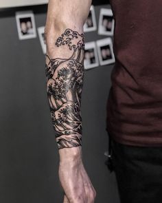 a man with a tattoo on his arm