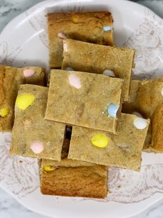 a white plate topped with cookies and marshmallows on top of each other