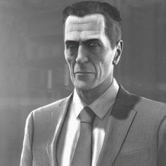 a black and white photo of a man in a suit with an evil look on his face