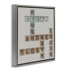 a cross made out of scrabble tiles with the words floss on it