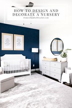 a baby's room with blue walls and white furniture