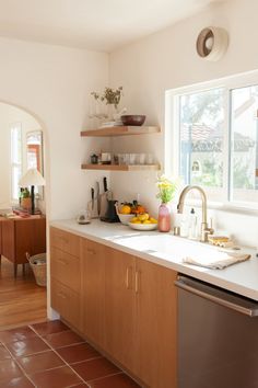 the kitchen is clean and ready for us to use it's dishwasher