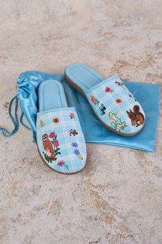 Slip into comfort and style with our Nathalie Lété Forest Slippers! With a soft outer, these comfortable summer slippers also have a durable sole, in case you need to pop outdoors. Featuring delicately embroidered squirrel and owl motifs, over a sky blue and white check base, pair these slippers with our Nathalie Lété Kimono, PJs or Cami Dress to create a whimsical matching set. Presented in a satin, drawstring bag these slippers make a lovely personal purchase or great gift idea. Embroidered Squirrel, Nathalie Lete, Olivia Newton John, Summer Slippers, A Sky, Cami Dress, Drawstring Bag, Sky Blue, Espadrilles