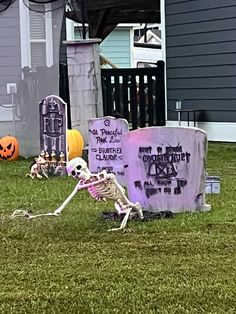 halloween decorations in the yard with skeletons and pumpkins