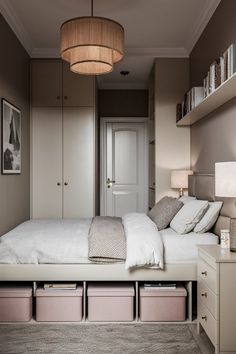 a bedroom with a bed, dressers and drawers in it's center area