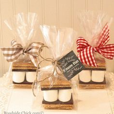 small marshmallows are wrapped in cellophane and tied with ribbon