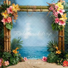 an image of a tropical beach scene with flowers and bamboo arch on the sand near the ocean