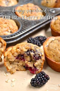 some muffins are on a table with berries