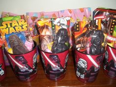 star wars themed plastic cups with candy in them