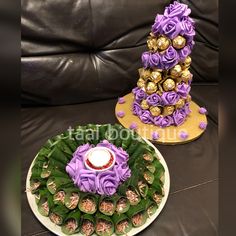 two cakes decorated with flowers and chocolates