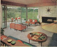 an old photo of a living room with orange furniture and large glass doors to the outside