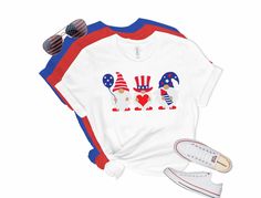 Show your patriotism with this cute 4th of July Gnomes shirt. This patriotic shirt is perfect for celebrating Independence Day, Memorial Day or just showing your loyalty.  Our Bella Tees are like finding a treasure at the end of a rainbow. Our shirts are super soft and become softer with each wash! ✿PLEASE SEE THE SIZING CHARTS for the measurements, and please consider comparing those measurements to a shirt that currently fits well. ✿Current production time is 3-5 business day. This is subject to change based on current order volume. If you need your order by a specific date please let us know before placing your order to make sure we can accommodate. Add RUSH MY ORDER upgrade your processing time to 1-2 business days. https://www.etsy.com/listing/578905255/rush-my-order-add-rush-for-fast Patriotic American Flag Shirt For Veterans Day, Patriotic American Flag Shirt For Labor Day, Patriotic American Flag Shirt For Memorial Day, Patriotic Pre-shrunk Shirt For 4th Of July, Patriotic Shirt With Flag Print For Labor Day, Patriotic Flag Print Shirt For Labor Day, Patriotic Flag Print Shirt For 4th Of July, Patriotic Shirt With Flag Print For 4th Of July, Patriotic Shirt With American Flag Print For Independence Day