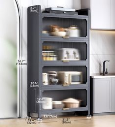 an image of a kitchen with the measurements for shelves in front of him and her