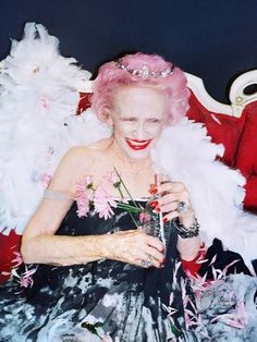 an old black and white photo of a woman wearing a tiara