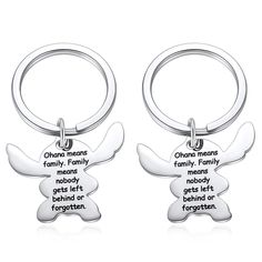 two key chains with words on them that say, ohoho means family means nobody gets