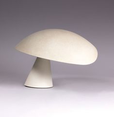 a white mushroom sitting on top of a table