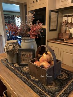 a wooden box filled with onions sitting on top of a kitchen counter